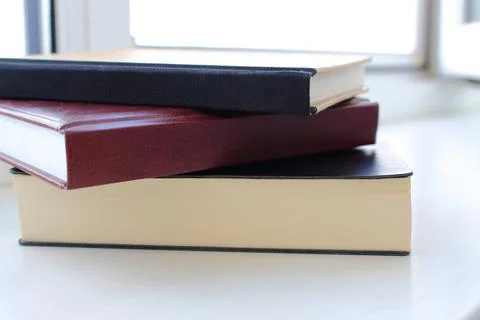 Pile of notepads on table. Office and business concept. Stock Photos