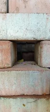 Pile of old bricks with a gap in the center 스톡 사진