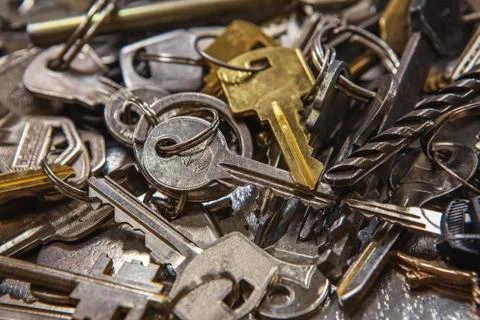 A Pile of old Keys different shapes and colors. Many vintage keys Stock Photos