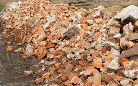 Pile of old red bricks. A pile of stones. Construction debris Stock Photos
