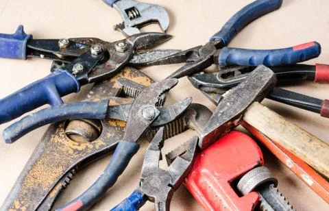 Pile of old tools for construction and repair of plumbing . Stock Photos
