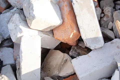 Pile of old used bricks. construction of houses. background Stock Photos