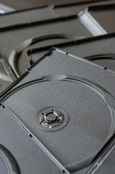 A pile of open plastic boxes for cd, dvd and blu-ray discs. Stock Photos