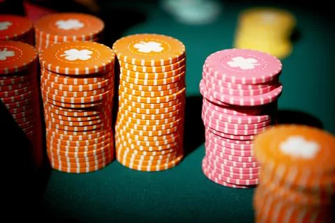 Pile or stack of poker chips representing the gambling theme Stock Photos