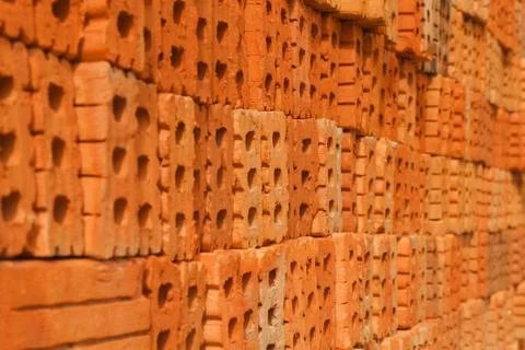 Pile of orange bricks for pattern and construction Stock Photos