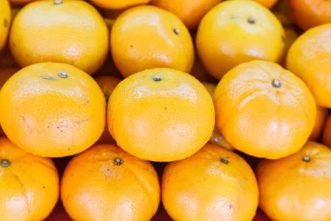 Pile of orange fruit Stock Photos