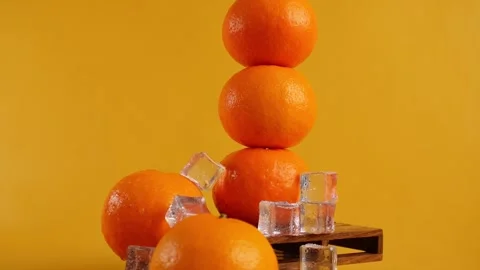 Pile of oranges collapsed with isolated yellow orange background Stock Footage 268379278