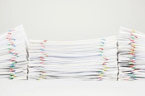 Pile overload document of report and receipt on white background Foto stock
