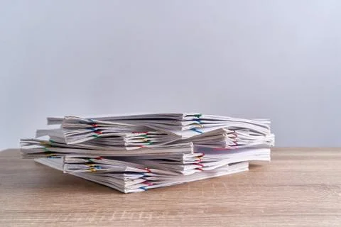 Pile overload document report of receipt on wood table Stock Photos