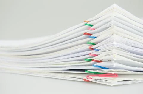 Pile overload document of report on white background Stock Photos