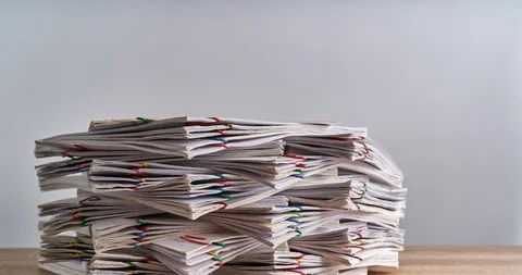 Pile overload document of report on wood table time lapse 動画素材 106069276
