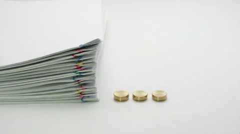 Pile overload paperwork and pile of gold coins  time lapse Stock Footage 67871464