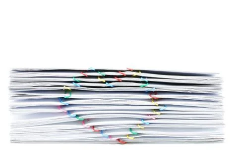 Pile overload paperwork with colorful heart-shaped paperclip place on white b Stock Photos