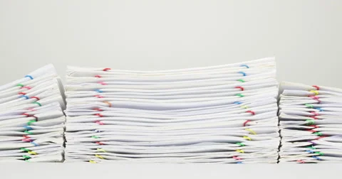 Pile overload paperwork of report on white background time lapse 動画素材 64511347