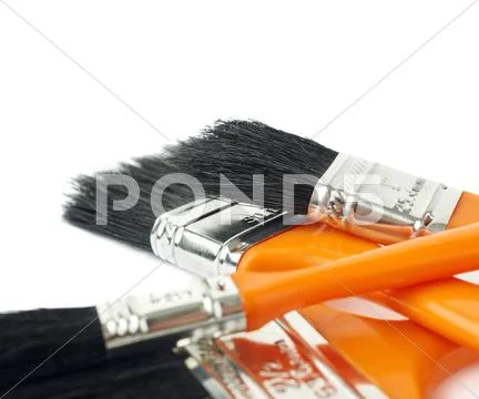 Pile of Paint brushes over isolated white background Stock Photos