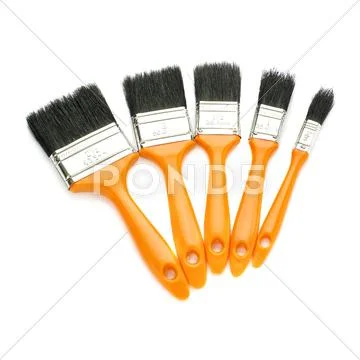 Pile of Paint brushes over isolated white background Stock Photos