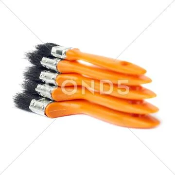 Pile of Paint brushes over isolated white background Stock Photos