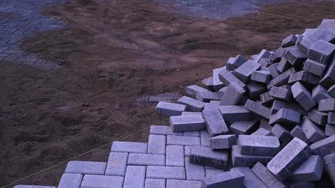 Pile of paving block, grey abstract textured background, copy space Stock Photos