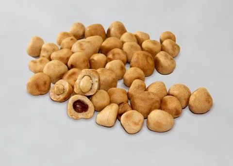 Pile of peanut coated on white background. Stock Photos