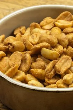 Pile of peanuts, close-up, in a dish Stock Photos