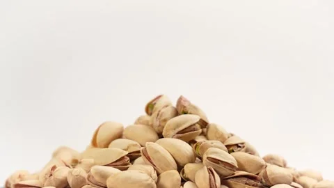 A pile of peanuts is spinning on a white background. Stock Footage 303594617