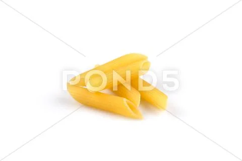 Pile of penne on white background Stock Photos