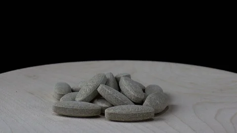 A pile of pills rotate Stock Footage 196073484