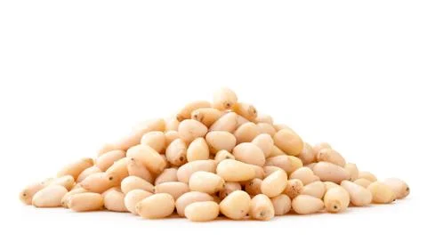 Pile of pine nuts close-up on a white. Isolated Stock Photos