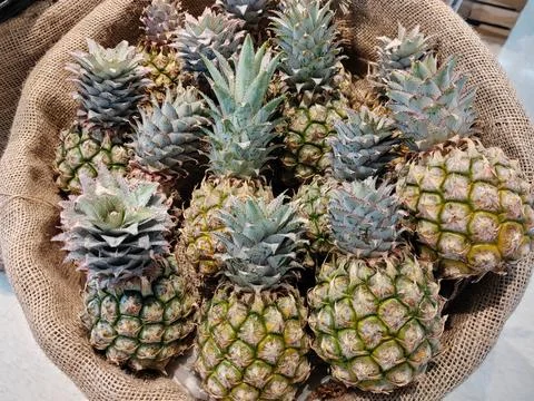 Pile of pineapples in the basket, Refreshing fruit for the summer. Stock-Fotos