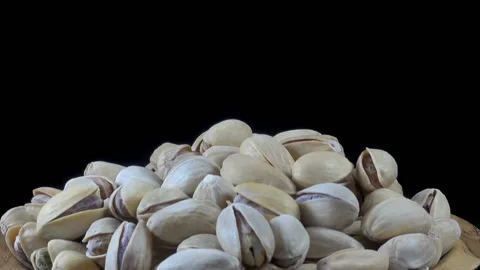 A pile of pistachio nuts rotates Stock Footage 146680025