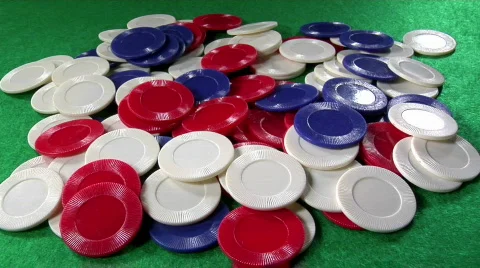 A pile of poker chips on a green felt table. Stock Footage 554874