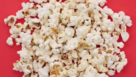 Pile of popcorn on red surface 库存影片 237498711