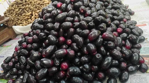 A pile of popular Indian Java plum fruits kept on a pushcart for sale Video stock 243577925