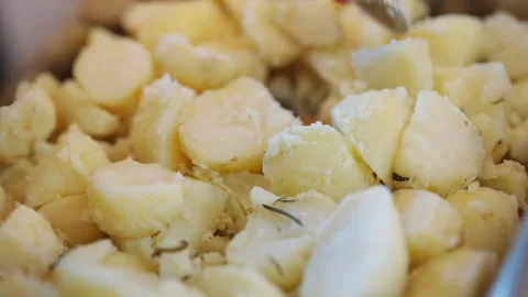 A pile of potatoes with herbs on top Stock Footage 295369017