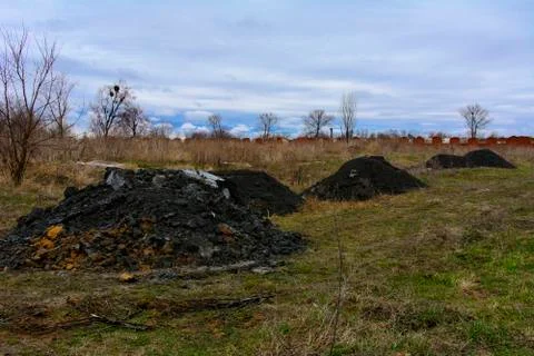 Pile of pulp in the field. Waste from the processing of granite in the work.. Stock Photos