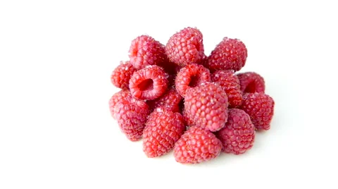 Pile of Raspberries Rotating on White Background Stock Footage 62024429