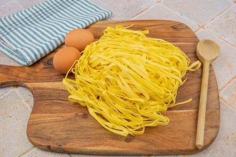 Pile of raw pasta on a table Stock Photos
