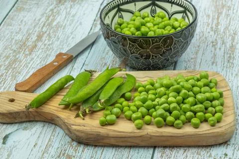 Pile of raw peas on a table Stock Photos