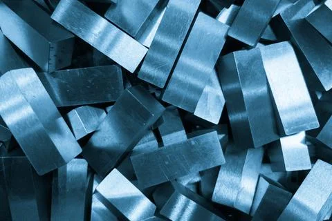 Pile of rectangular steel workpieces after surface grinding Stock Photos