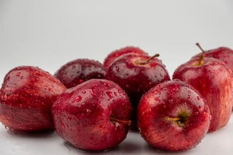 Pile of red apple with clear water drop on  shell surface texture isolated Stock Photos
