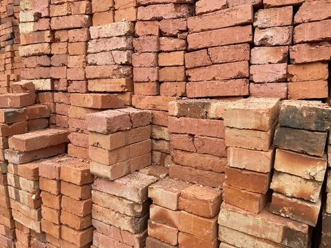 A pile of red bricks as a background for your design Stock Photos