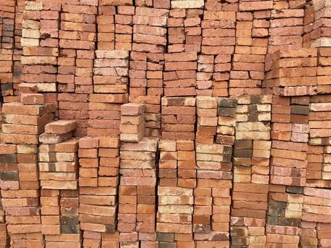 A pile of red bricks as a background for your design Stock Photos