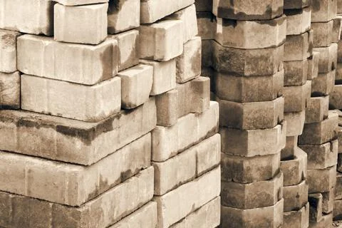 Pile of red bricks is construction materials. Stock Photos