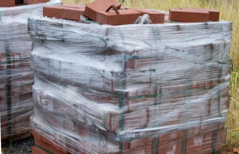 A pile of red bricks is prepared for construction work Foto stock