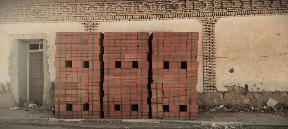 Pile of red bricks ready for construction Stock Photos