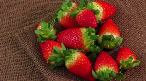 Pile of red strawberries on jute Stock Footage 59186562