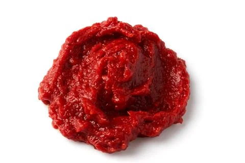 A pile of red tomato paste isolated on white background. Stock Photos