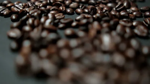 Pile of roasted coffee beans on black surface Stock Footage 162522517