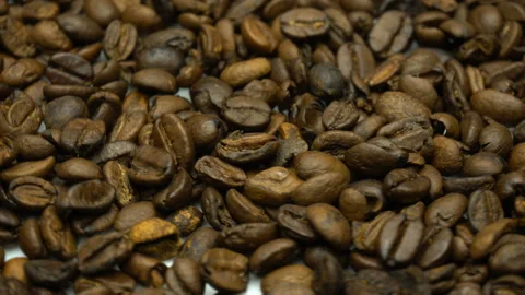 A pile of roasted coffee beans rotating. Close up Stock Footage 86213159