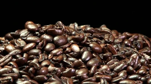A pile of roasted coffee beans slowly rotating. Stock Footage 73200224